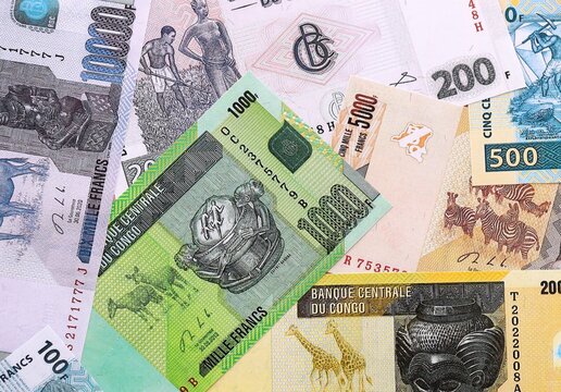 CFA franc money bills pile on table. Republic of the Congo banknotes of XAF currency close up.