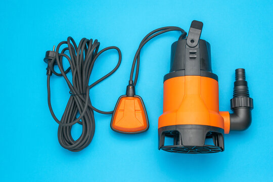 Orange Submersible Water Pump with Cord and Float Switch on Blue Background