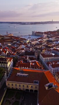 Aerial View of Alfama District and Praca do Comercio at Sunset Lisbon Portugal. Vertical video