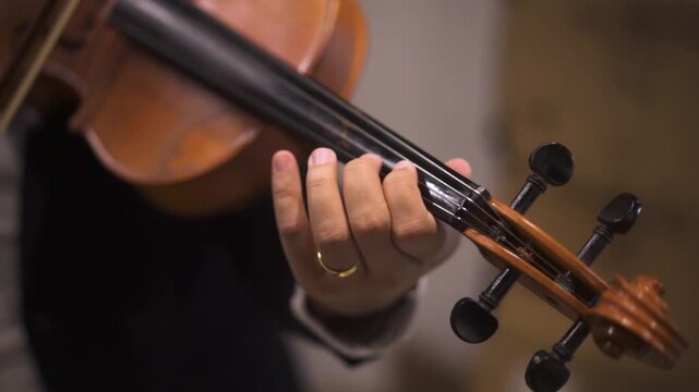 Close up of Musician Playing Violin in Professional Suit 