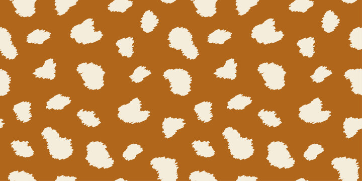 Seamless animal skin pattern with irregular shapes in brown and beige tones. Deer spots background for fashion textiles, wallpaper. Modern print texture. 