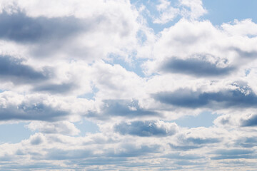 Obraz premium Blue sky with scattered clouds. Weather concept. Natural atmosphere background. Open air environment. Calm outdoor scene for climate seasonal design and travel backdrop use.
