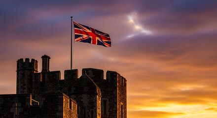 The union jack flag flying over the historic windsor castle at sunset © S M Sajib