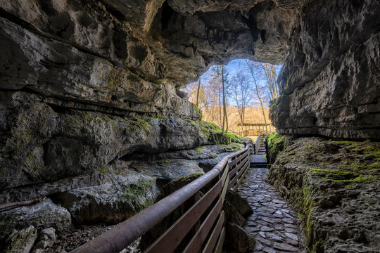 Path towards the exit of a karst cave. Vigant abyss (Abisso Vigant) Villanova, Nimis, Udine, Friuli Venezia Giulia, Italy.