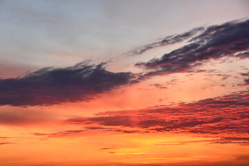 Fototapeta premium Vibrant Sunset Sky with Dramatic Clouds copy space