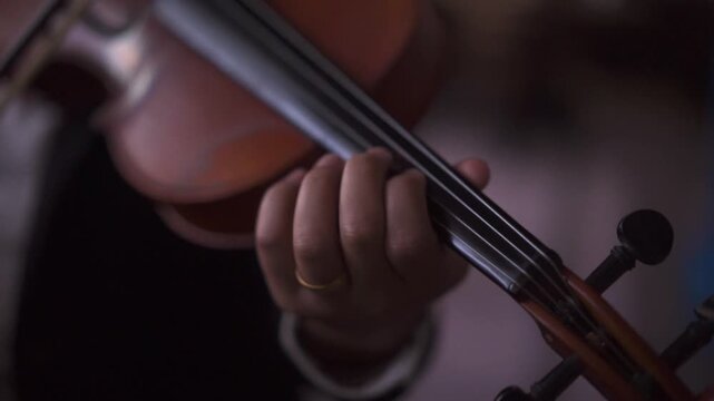 Close up of Musician Playing Violin in Professional Suit