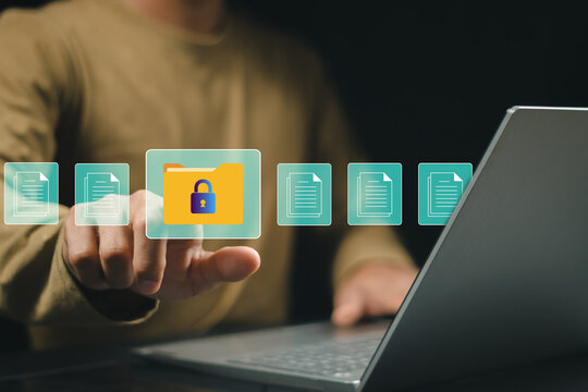 Businessman using a tablet and pen to write in a digital document file system with an icons for secure and confidential access to documents, protecting personal data and organizational information.