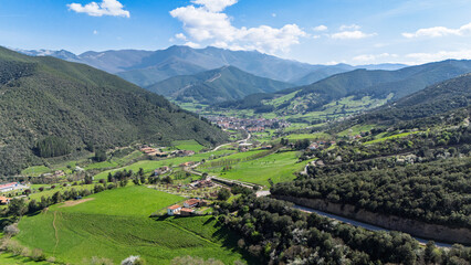 Fototapeta premium Aerial drone view of San Miguel in Potes Cantabria Spain hermitage and viewpoint near Santo Toribio with Picos de Europa on a sunny day