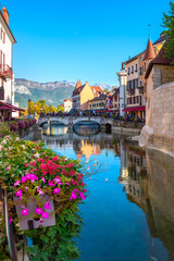 Scenic view with bridge and houses along Canal du Thiou in old town Annecy. French Alps, France