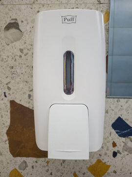 Votkinsk, Russia - February 25, 2026: Thermal complex "Teplaya volna". White soap dispenser mounted on wall with visible brand name Puff in modern restroom setting