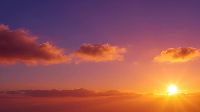Vibrant sunset with clouds in the sky during twilight hours above sea level