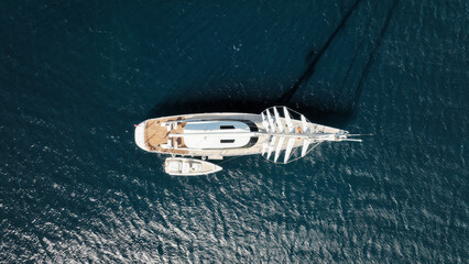 Aerial drone photo of beautiful sail boat anchored in deep blue Aegean Sea © aerial-drone