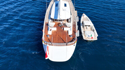 Aerial drone photo of beautiful sail boat anchored in deep blue Aegean Sea © aerial-drone