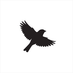 Obraz premium Simple black silhouette of a small bird captured in mid flight showing wings spread wide against a white background.