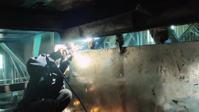 Industrial hinge welding for coal damper system, right side perspective.