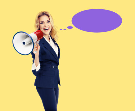 Expressive happy cute young business woman in suit, hold mega phone loudspeaker megaphone say, shout advertise. Blond businesswoman, isolate yellow background. Violet purple speech bubble speechbubble
