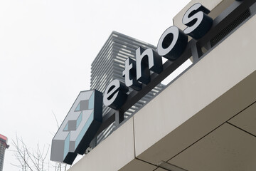 Fototapeta premium skyward view of sign outside Ethos Climbing, a rock climbing gym, located at 128 Queens Quay E, Toronto