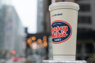Fototapeta premium discarded beverage cup of Jersey Mike's, an American fast-food submarine sandwich chain, Toronto