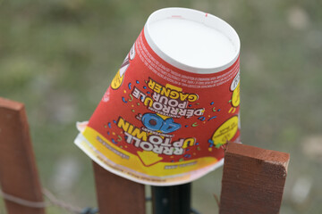 Fototapeta premium squashed, upside-down discarded Tim Hortons beverage cup featuring 