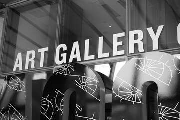 Fototapeta premium black and white view of sign (detail) outside main entrance to the Art Gallery of Ontario, 317 Dundas St W, Toronto