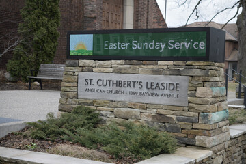Fototapeta premium electronic and traditional sign outside St Cuthbert's Anglican Church, 1399 Bayview Av, East York, Toronto
