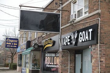 Fototapeta premium exterior building and sign of VapeGoat Vape Shop, a vaporizer store, located at 1489 Bayview Av, East York, Toronto
