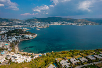 Obraz premium Bodrum, Turkey. Drone view of Bodrum bay from a hilltop under the bright spring sun. Aerial View, Camera Departure