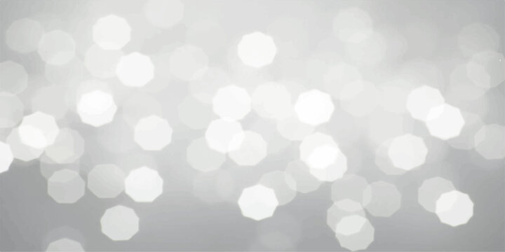Bright abstract bokeh background featuring a blurred blue and silver Christmas design with shiny glitter circles and a glowing winter snow texture for a festive holiday decoration