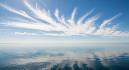 Fototapeta premium Serene Ocean Reflection Under Bright Blue Sky with Wispy Clouds