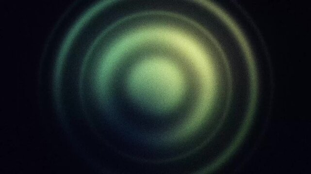 Abstract pulsing rings and circles looping animation with noise texture. Abstract green and yellow grainy animated background