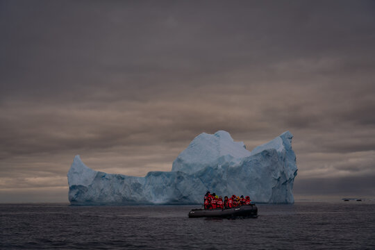 Sunrise, Charcot Bay Zodiac cruise Antartica with lots of icebergs