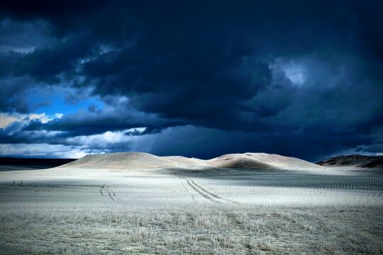 A sapphire sky broods over rugged Eastern Montana hills
