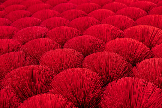 Close up of right red incense sticks in Vietnam in a craft village