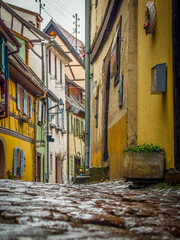 Charming cobblestone street in eguisheim alsace france