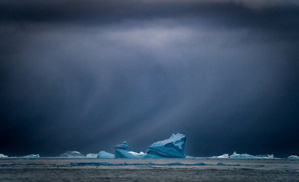 Sunrise, Charcot Bay Zodiac cruise Antartica with lots of icebergs