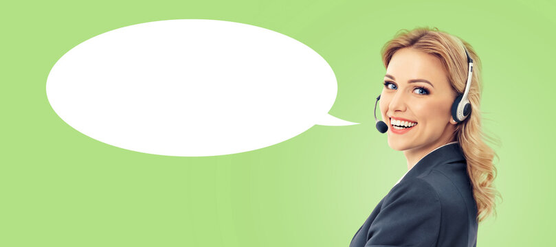 Representative call center. Blond businesswoman callcenter support phone operator wear headset, black suit, isolated soft green background. White empty mockup speech bubble. Customer service help ad