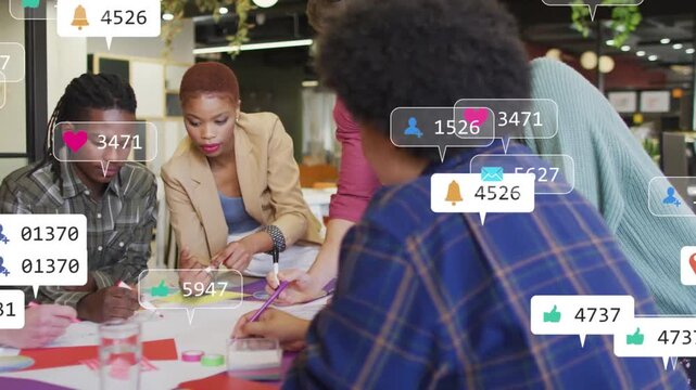 Reacting to social overlays appearing, business team writing sticky notes, sharing markers at table