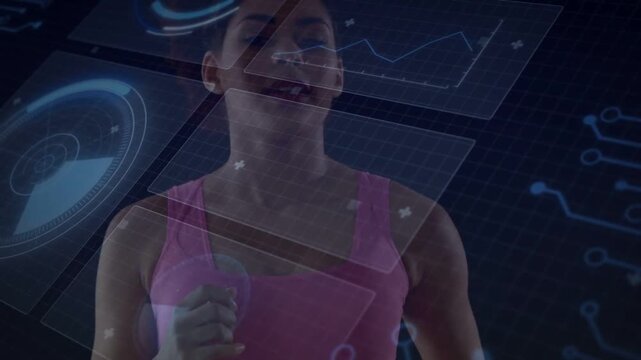 Woman standing facing camera raising right hand and engaging hologram radar graph code in tech demo