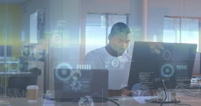 Vertical video: Typing man in white tee analyzing data at office desk with laptop and HUD appearing