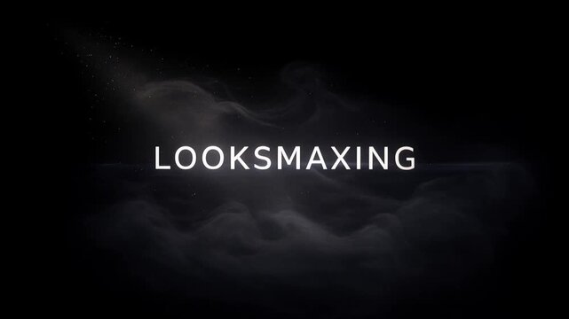 Looksmaxing text emerging from darkness, cinematic minimal typography reveal on black background