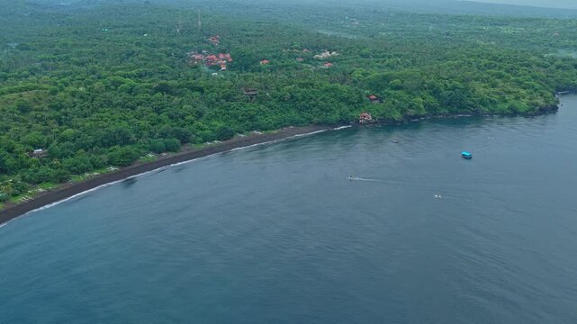 Aerial view of bali's amed coast and mount agung volcano