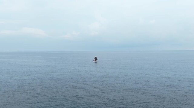 Traditional balinese jukung fishing boat sailing in amed
