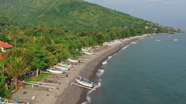 Aerial view of amed beach with traditional jukung fishing boats