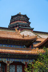Obraz premium The majestic multi-tiered Tower of Buddhist Incense, showcasing its intricate colorful eaves and traditional architecture against a clear blue sky at the Summer Palace in Beijing, China - 27 May 2025