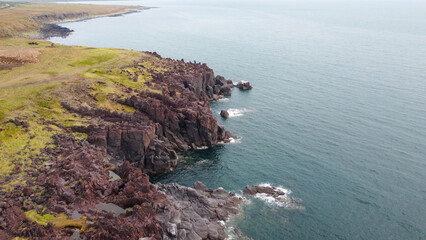 White rocks on the coast of the Sea of Okhotsk in Iturup Island, Kuril Islands,Russia . © larisa_stock