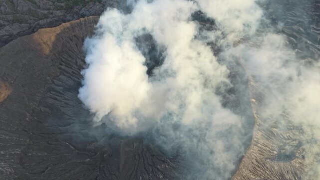 Smoking crater of mount bromo volcano aerial view