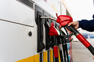 Driver refueling car using gasoline pump. © Rabizo Anatolii