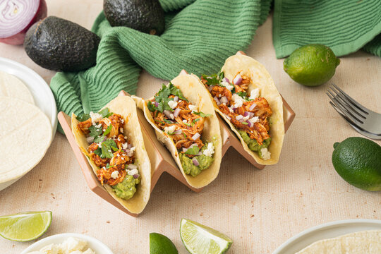 Easy slow cooker chicken tinga tacos. Spicy Mexican food 