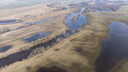 Fototapeta premium Aerial View of Flooded Meadows in Early Spring Landscape