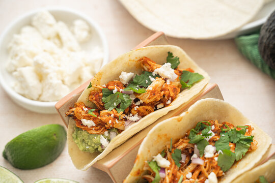 Easy slow cooker chicken tinga tacos. Spicy Mexican food 